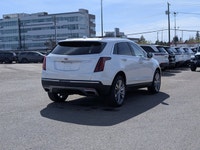 The pre-owned 2024 Cadillac XT5 Premium Luxury AWD in Mary Kay Pearl with a Jet Black interior deliv... (image 6)