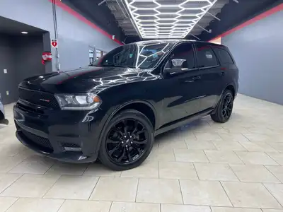 Experience the bold presence and versatility of the 2019 Dodge Durango GT in striking black with an...