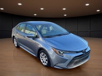 The 2023 Toyota Corolla LE in gray is a forward-thinking sedan that seamlessly marries stylish desig... (image 3)