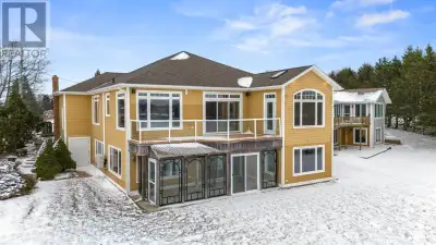 Set on a 0.4 acre waterfront lot, 5 Chelsea Lane this custom back-split home features over 3,200 sq....