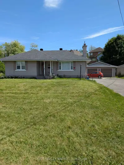 Welcome to this bungalow on a large lot that is just steps away from Mooney's Bay and a short drive...
