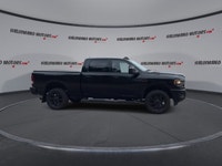 Meet the 2023 RAM 2500 Big Horn 4x4 Crew Cab 6'4 Box with the Night Edition package, offered by Hald... (image 8)