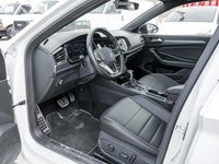 The 2024 Volkswagen Jetta Comfortline stands out in a refined White finish that complements its slee... (image 8)