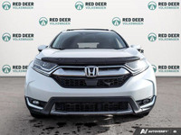 Experience the reliability and power of the 2017 Honda CR-V Touring in stunning white, equipped with... (image 1)