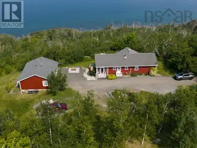 Welcome to 8646 Highway 337, Morar your private oceanfront retreat on over 7 acres with breathtaking...