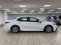 Introducing the 2023 Toyota Camry SE, a sedan that marries elegance with efficiency, creating a driv... (image 6)