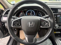 A well-equipped compact sedan with a refined interior, advanced tech features, and efficient turboch... (image 9)