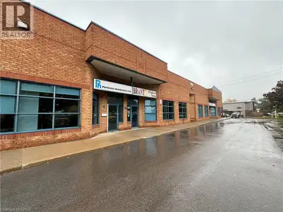 Front corner office unit connected to a clean air conditioned warehouse/assembly area with a double...