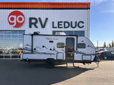Lightweight and versatile 2022 Wolf Pup 18TOBL travel trailer, perfect for couples or small families...