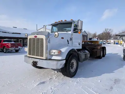 Heavy Tandem Roll Off Truck Complete with JWH System 25ft Rails 20 46 Axles 8LL Transmission Paccar...