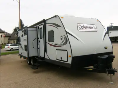 Family Travel Trailer that Sleeps 10 which includes; 2 Large Bunks and 2 Entrances with one into the...