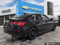 Enjoy year-round comfort and modern convenience in this sleek 2024 Honda Civic Sedan Sport. With jus... (image 4)