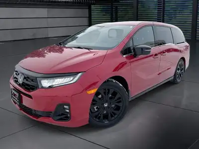 The 2025 Honda Odyssey Black Edition in a striking Red finish, equipped with a Front-Wheel Drive, of...