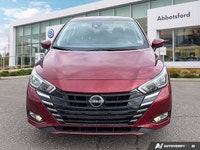 Designed for efficiency and confident urban navigation, this vibrant red 2024 Nissan Versa SV, is yo... (image 6)