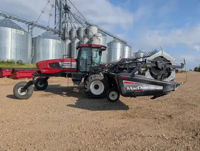 2009 Macdon M200 Windrower Swather. Engine hrs: 2,767 Header HRS: 1811 Cat Motor 200hp. D60D header...