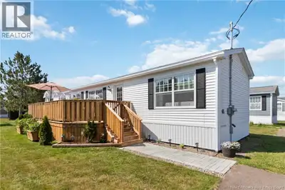 Welcome to 65 Ulysse Drive, a stunning three-year-old mini home in the desirable Domaine Dover Estat...