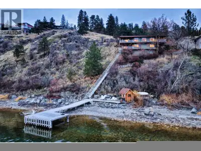 Perched above Okanagan Lake in Vernon’s coveted Adventure Bay community, this lakefront retreat capt...