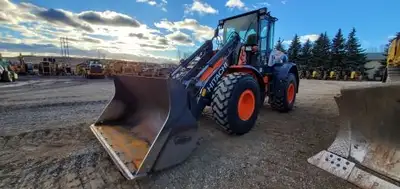 2054 hrs. With Coupler, Forks and Bucket. Warranty Options, Remainder of 5yrs / 5,000 hrs, expires A...