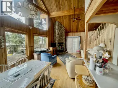 Perched along the western edge of beautiful Gun Lake you will find this 1416 ft2 Lynwood cedar cabin...