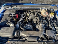 Conquer every landscape in this 2023 Jeep Gladiator Rubicon, gleaming in Hydro Blue Pearl. With only... (image 9)