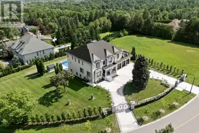 Welcome to an extraordinary custom estate in the exclusive Woodland Acres community-an unforgettable...