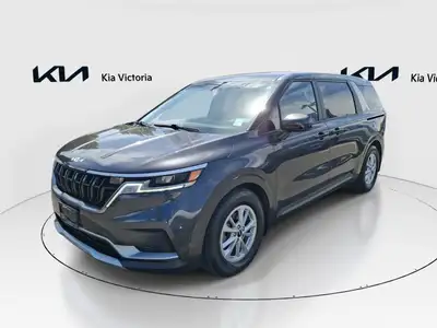 Introducing the 2023 Kia Carnival LX in a sophisticated gray finish with a front-wheel-drive system...