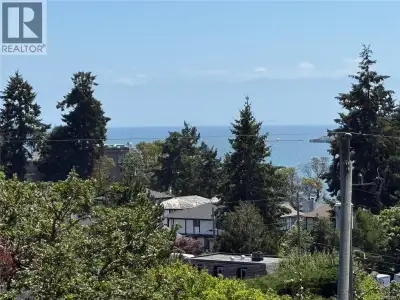 Rare 0.84-acre OCEAN view property on the sought-after water side of View Royal Avenue. This three-l...