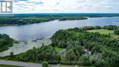 Discover the perfect blend of peaceful seclusion and modern comfort at this charming year-round home...