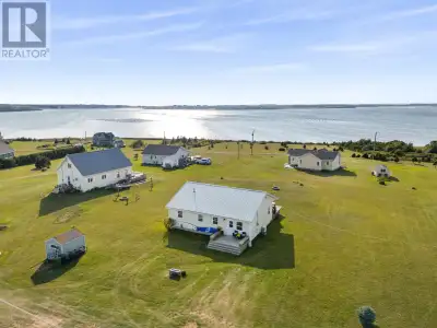 Wake up to stunning water views from the meticulously maintained 3 bedroom, 2 full bath cottage over...