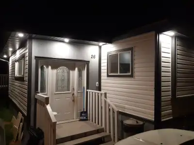 Substantially renovated three bedroom mobile home is move in ready! This mobile has had so much work...