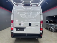The 2025 Ram ProMaster Cargo Van in a clean white finish, equipped with front-wheel drive, is design... (image 8)