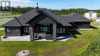 Drive through the security gates and experience luxury acreage living just minutes from Edson on 9.8...