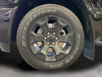 The 2026 Ram 1500 Big Horn, presented in a commanding Black finish and equipped with a robust 4x4 dr... (image 8)