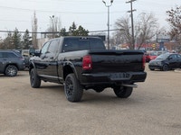 The 2026 Ram 2500 Limited Mega Cab Night Edition in Diamond Black Crystal Pearl delivers bold stylin... (image 3)