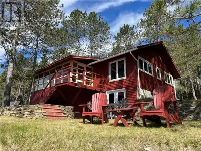 One of a kind four season CAMP or ""OFF-GRID HOME"" on the Cains River. ""Pine Bluff Lodge"" is a ra...