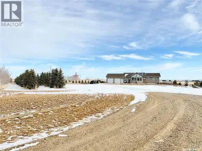 Just 3 kms from Weyburn, this beautiful 1659 sq ft 2008-built acreage offers the perfect blend of sp...
