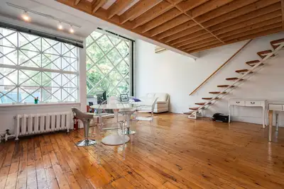Annex Loft on Lowther Avenue Cathedral Ceilings Large Windows Stylish Art Decor