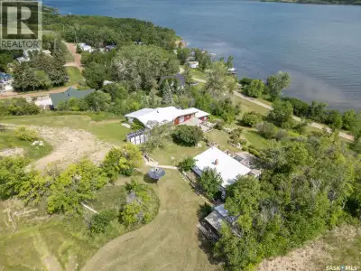 2 acres of LAKEFRONT on a hill overlooking Buffalo Pound Lake! 1870 square feet main (year round) ho...