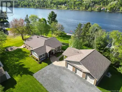 Welcome to this breathtaking 5-bedroom, 3-bath waterfront retreat on the serene Tobique Head Pond in...