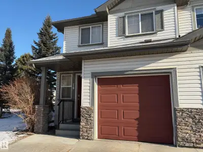 End-unit townhouse nestled beside the scenic Mill Creek Ravine with direct access to walking trails,...