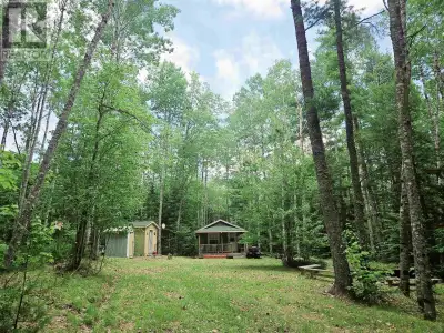 Tucked away from the noise of everyday life and nestled among the trees, this charming one-bedroom,...