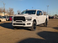 The 2026 Ram 2500 Laramie Crew Cab Night Edition in Bright White combines aggressive style, heavy-du... (image 1)