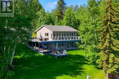 Stunning lakefront home with 147' of shoreline in a quiet bay, offering beautiful views of Eskers Pa...