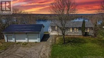 Privately set on just under an acre, this impressive walkout bungalow offers direct waterfront acces...