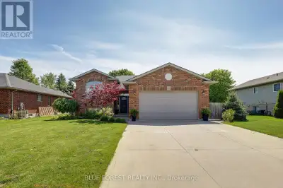 This beautifully landscaped and meticulously maintained raised bungalow is tucked away on a quiet st...