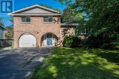 This beautifully renovated four-bedroom, three-bathroom side split blends modern style with classic...