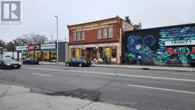 This property features a classic red brick storefront located in the bustling and vibrant section of...