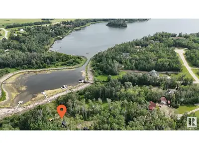 Lakefront on Jackfish Lake! This stunning 2.57-acre estate offers ultimate privacy with a gated entr...