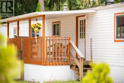 Charming & affordable mobile home in a park that is welcoming to family and pets. Placed in a settin...