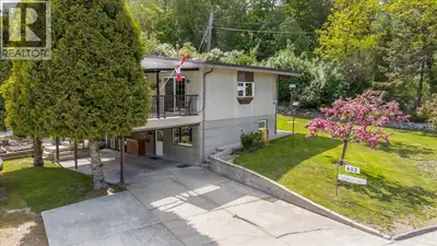 Tucked away on a quiet dead-end street and positioned on a beautiful corner lot, this property offer...